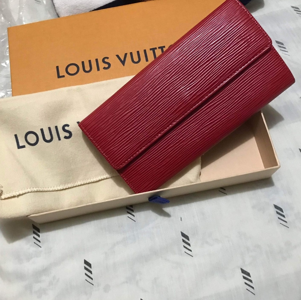 Sold authentic Louis Vuitton Epi long red wallet